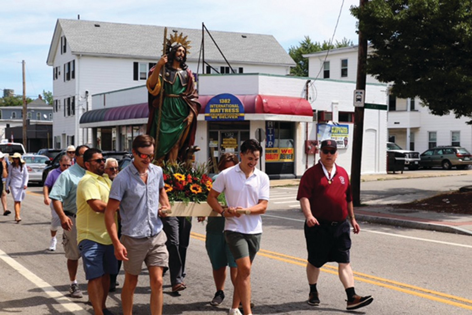 CARRYING TRADITION: Holy Name Society members carried St. Rocco during a traditional part of the annual feast.